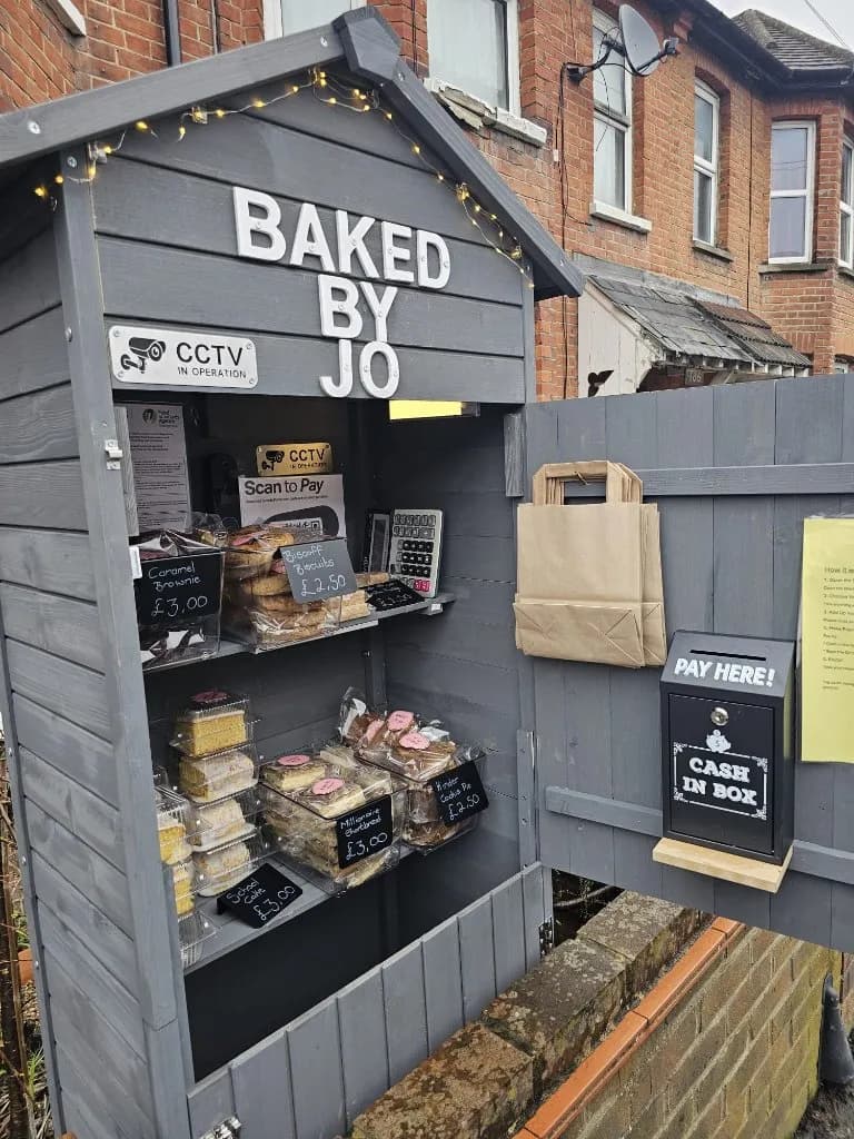Jo's bakery shed stocked with fresh bakes and chalkboard prices